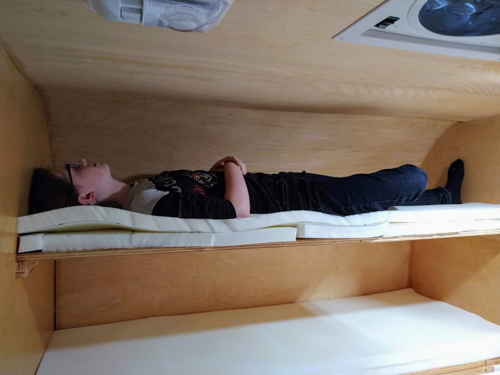 kid trying out the bunk