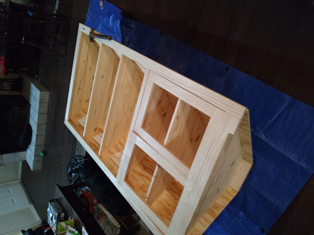corner cabinet being fitted for doors